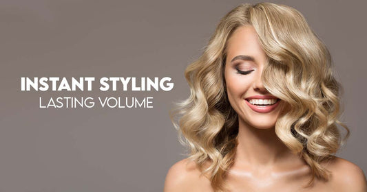 Blonde using heat protectant hair spray for voluminous curls"